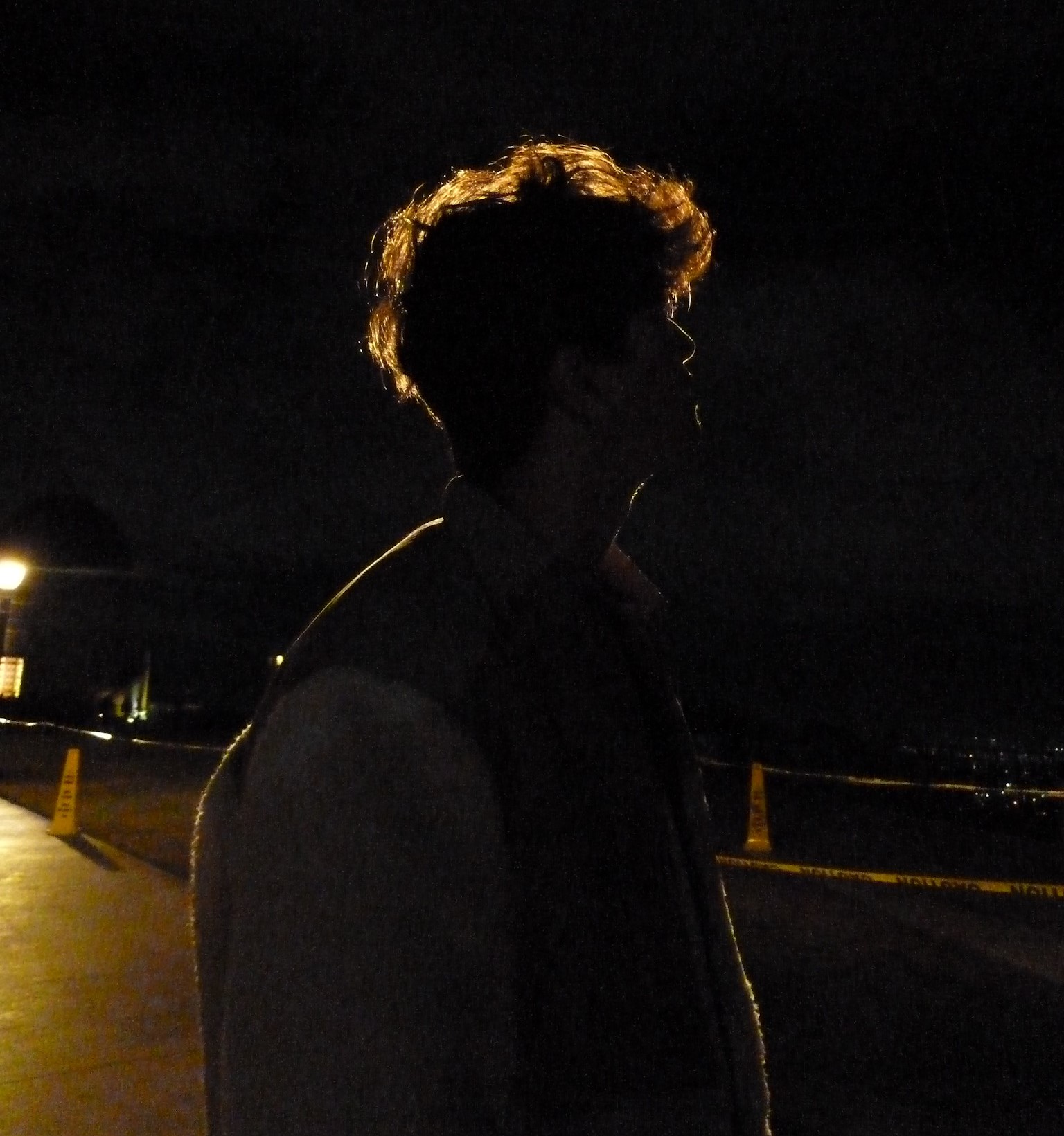 Kian Aimi silhouetted at night